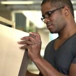 stock-footage-man-searching-through-books-at-the-library