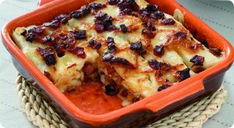 Lasagne di polenta bianca con speck cipolle brasate e fontina