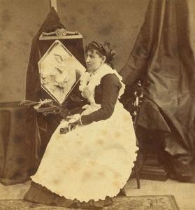 Caroline S. Brooks and her sculpture in butter during a public exhibition at Amory Hall, Boston, USA, in 1877.