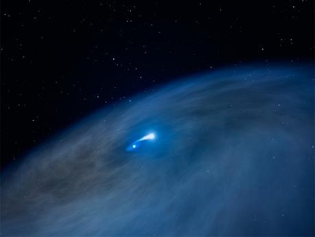 Questa impressione artistica rivela un ampio disco di gas che circonda una stella di Wolf-Rayet (mostrata al centro). Una stella compagna sta attirando a sé gli strati esterni della Wolf-Rayet, come mostra il ponte di materiale brillante che collega le due stelle. Questo atto di cannibalismo stellare espone il nucleo di elio della stella massiccia. Parte del materiale, tuttavia, si disperde nello spazio formando unu enorme disco. Questa struttura a disco non è mai stata osservata prima d'ora intorno ad una stella Wolf-Rayet. Crediti: NASA, ESA e G. Bacon (STScI)