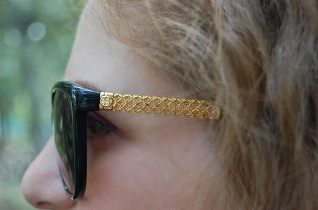 occhiali da sole gucci nero e oro