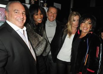 LONDON, ENGLAND - FEBRUARY 18:  Sir Philip Green, Naomi Campbell, Vladimir Doronin, Kate Moss and Dame Shirley Bassey pose backstage during Naomi Campbell's Fashion For Relief Haiti London 2010 Fashion Show at Somerset House on February 18, 2010 in London, England.