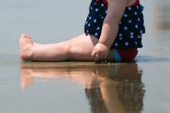 This past week was my daughter's first trip to the beach. We really limited her time there, but she really liked what time she did spend on the sand, she loved to mush the mud in her hands. I had a lot of other shots from this set, but I thought this one was the most 'artistic'.