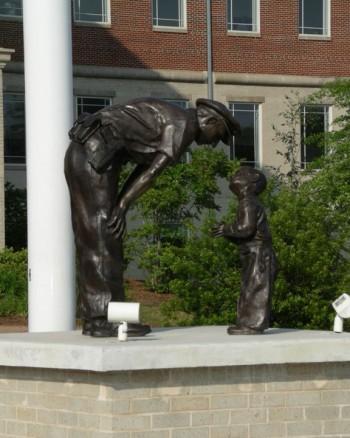 UNDATED HANDOUT IMAGE: A statue in Jonesboro, Ga. depicts Bill Beall's Pulitzer-winning photograph of a D.C. police officer and a boy taken in 1957. (Courtesy of Denny Beall)