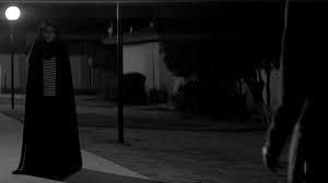 A girl walks home alone at night