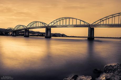 a golden bridge across a golden river under a golden sky ( #Portugal #riverTagus #VilaFrancaXira)