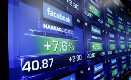 The board shows a small gain as Facebook begins trading after at the Nasdaq in Times Square in New York City on May 18, 2012. Facebook Begins trading publicly for the first time today under the symbol (FB).    UPI/John Angelillo  -INFOPHOTO