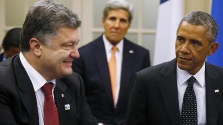 U.S. President Barack Obama is seated with Ukraine President Petro Poroshenko as they meet with other countries regarding Ukraine at the NATO summit at Celtic Manor in Newport, Wales, Thursday, Sept. 4, 2014. At rear center is U.S. Secretary of State John Kerry. (AP Photo/Charles Dharapak)