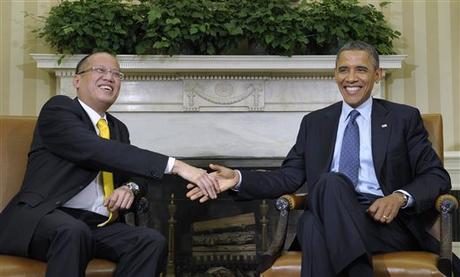 President Barack Obama meets with Philippines President Benigno Aquino, Friday, June 8, 2012, in the Oval Office of the White House in Washington. (AP Photo/Susan Walsh)