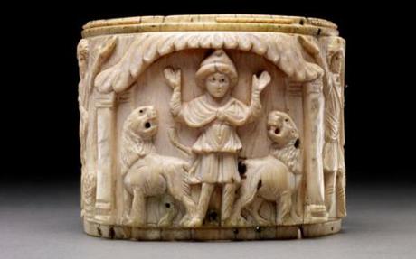 Ivory pyxis box depicting Daniel with arms raised in prayer flanked by two lions, Egypt 5th century AD Credit The Trustees of the British Museum