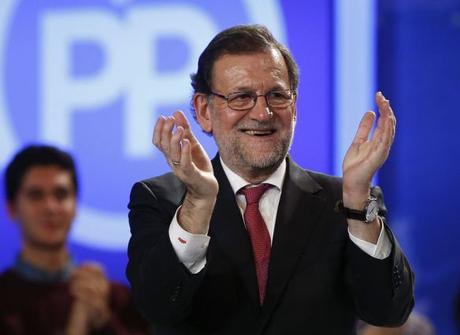 Spain's Prime Minister and People's Party (PP) leader Mariano Rajoy applauds during the final campaign rally for Spain's general election in Madrid