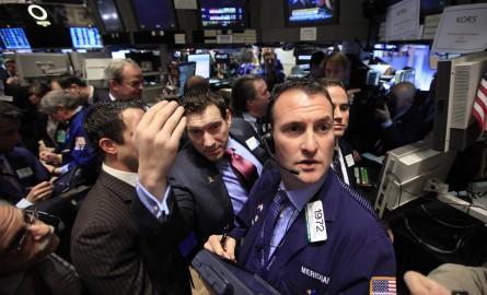 Traders await the start of the trading for Michael Kors Holdings Ltd. on the floor of the New York Stock Exchange December 15, 2011. Michael Kors Holdings Ltd shares rose 25 percent in their market debut, a day after the company increased the size of i...