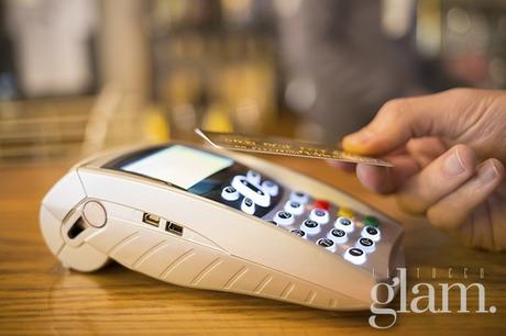 Man paying with NFC technology on credit card, restaurant, shop