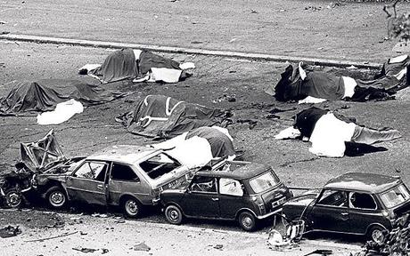 Horses lay dead among the debris of the Hyde Park bombing in 1982 (PA)