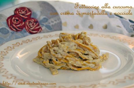 Fettuccine di semola alla curcuma con crema di mortadella e nocciole