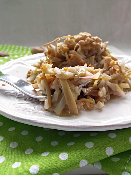 Risotto allo spumante e carciofi con noci e polvere d'arancia