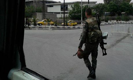 Syria - soldier patrols street in Damascus