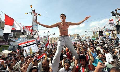 Yemenis celebrate the exit of President Ali Abdullah Saleh to Saudi Arabia for medical treatment