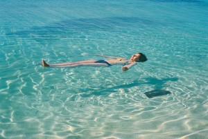 Cuba-Trinidad-Caribbean-Sea-Playa-Ancon-woman-floating-on-clear-water-shadow-1-MY