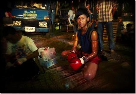 Thailand, Isan region, Buriram, Wat Sarbua Buddhist temple festival, Muay Thai kick boxing in temple, Lo Ma young girl boxer