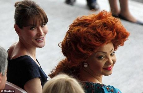  Carla Bruni-Sarkozy (L) sits with Cameroon First Lady Chantal  Biya