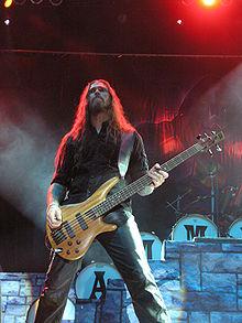 http://upload.wikimedia.org/wikipedia/commons/thumb/1/14/Masters_of_Rock_2007_-_Hammerfall_-_Fredrik_Larsson_-_01.jpg/220px-Masters_of_Rock_2007_-_Hammerfall_-_Fredrik_Larsson_-_01.jpg