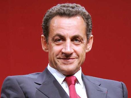 Il ghigno di Sarkozy.