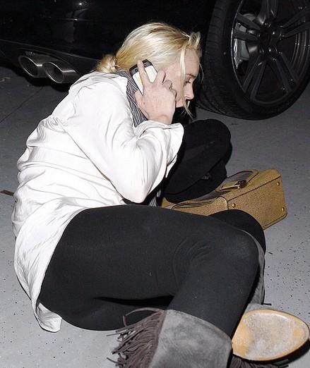 Lindsay Lohan collapses on the floor