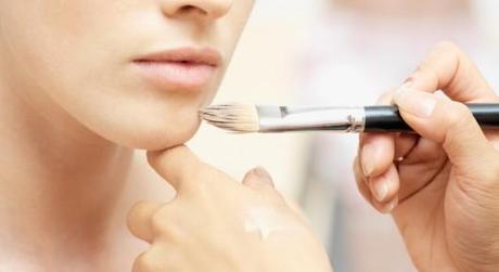 Woman having make-up done