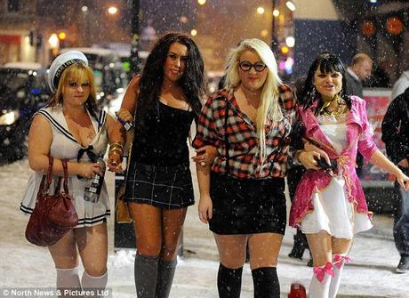 Who needs a coat? Partygoers hit the town in snowy Newcastle at the weekend