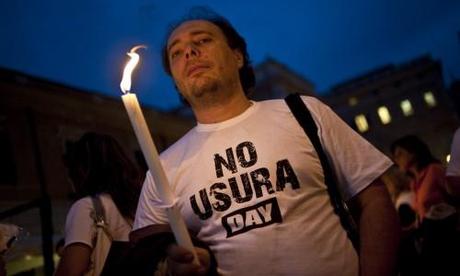 Un manifestante del No Usura Day (Credits: GUIDO MONTANI/ANSA)