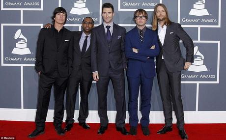 They mean business: Levine - who is also a talent judge on The Voice - poses with his Maroon 5 bandmates