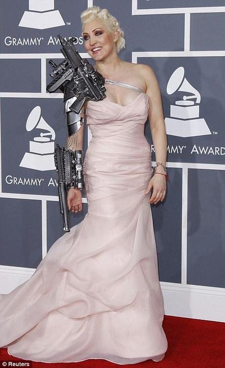 Leaving a lot to be desired: Singer Sasha Gradiva wears metal armature for the awards, while Nadeea goes over the top