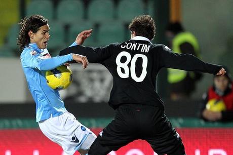 Edinson Cavani Matteo Contini of AC Siena fights for the ball with Edinson Cavani of SSC Napoli during the Tim Cup match between AC Siena and SSC Napoli at Artemio Franchi - Mps Arena Stadium on February 9, 2012 in Siena, Italy.